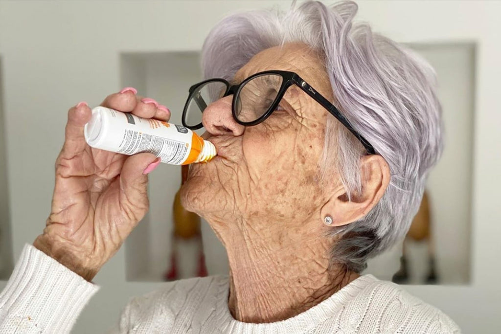 Old woman drinking immunity drink